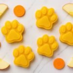Apple and Carrot Hydration Ice Pops dog treats laid out on kitchen surface